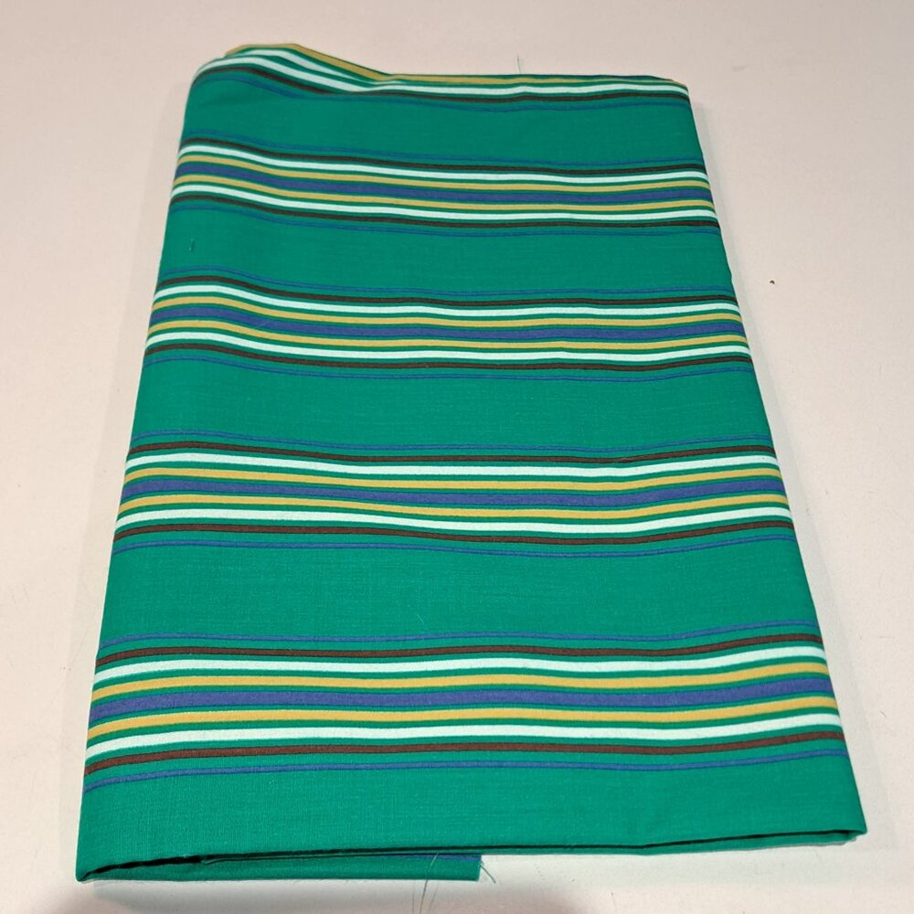 green white black blue yellow striped fabric